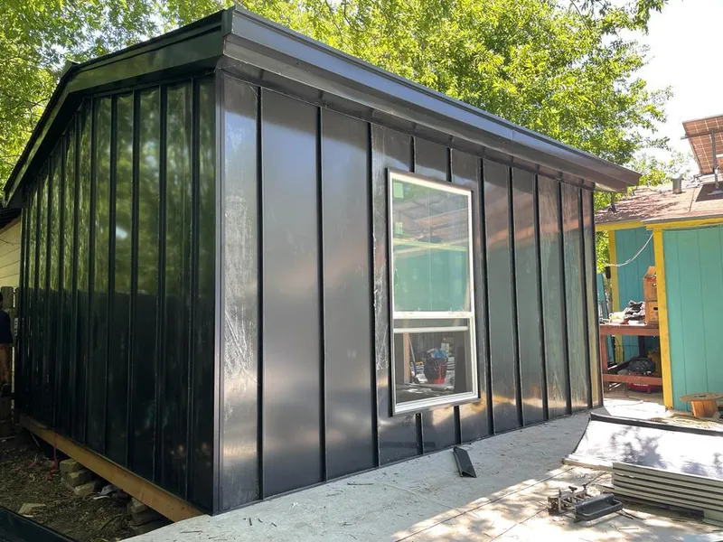 Black standing seam metal wall panels for Roof Inspection in Bellaire