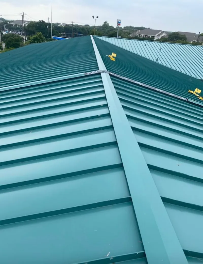 Green commercial metal roof ridge and valley for Metal Roof Repair in Bellaire